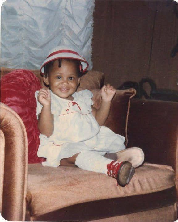 Sweet baby photo of Marien in a white dress and hat