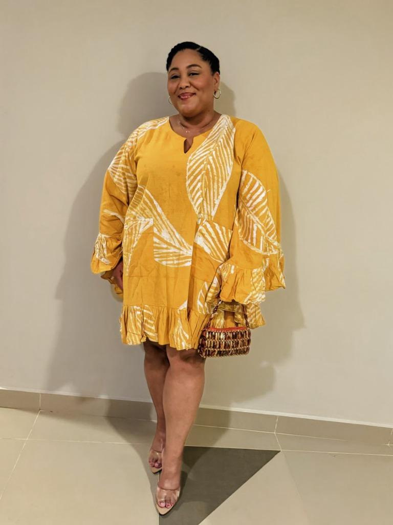 Marien in a beautiful yellow leaf-print dress